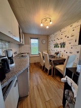 Ferienwohnung in Börgerende - Bull - Küche: Tapete neu in 2024